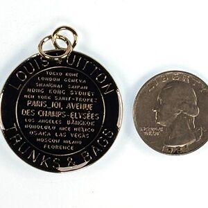 Louis Vuitton two sided Black and Gold enamel & metal Charm